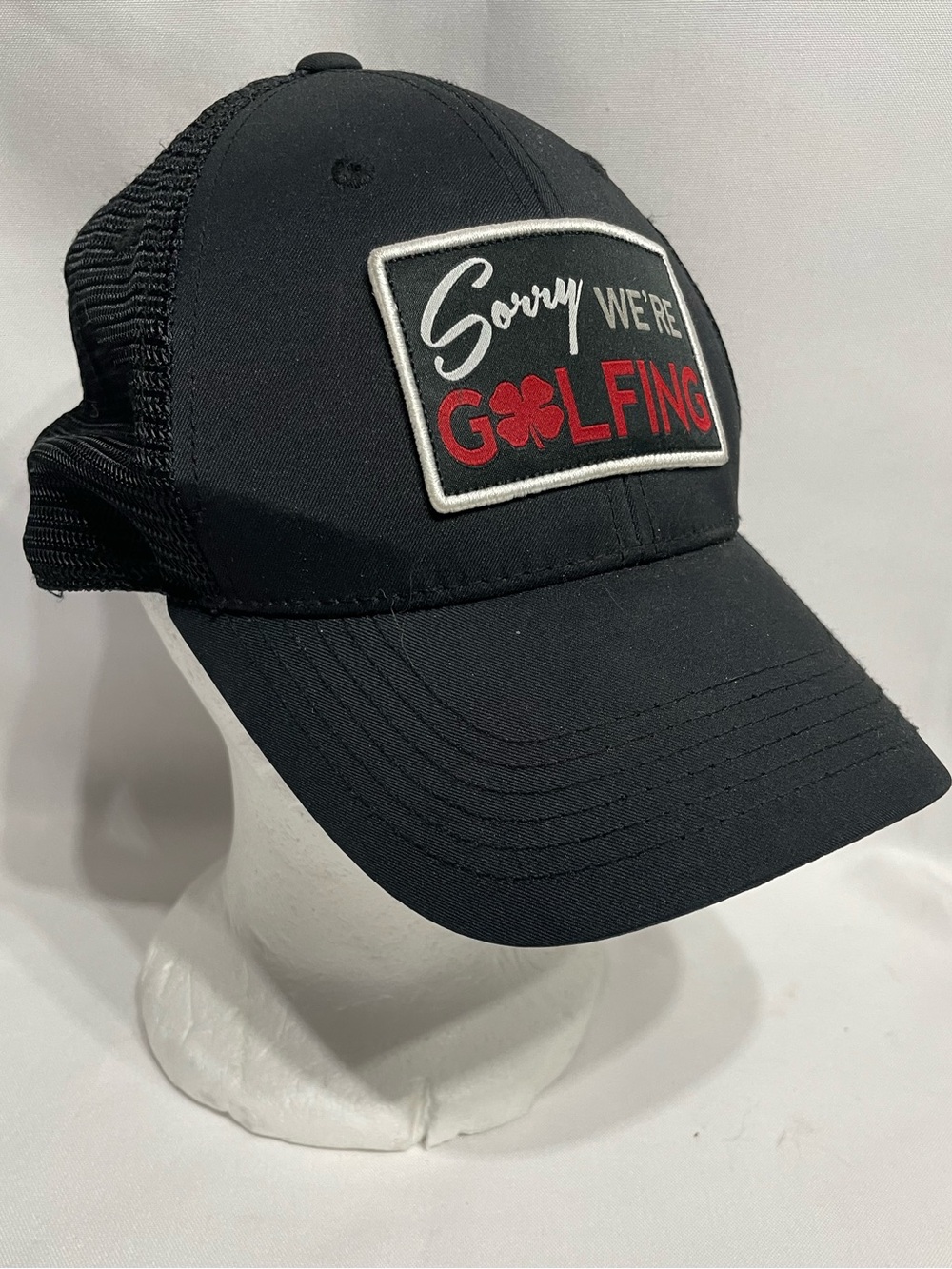 Black Clover "Sorry We're Golfing" black patch trucker hat breathable mesh back